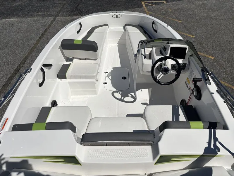Slide: The Image of 2024 Tahoe T16 boat interior with seating and steering console, featuring modern design elements. - 11