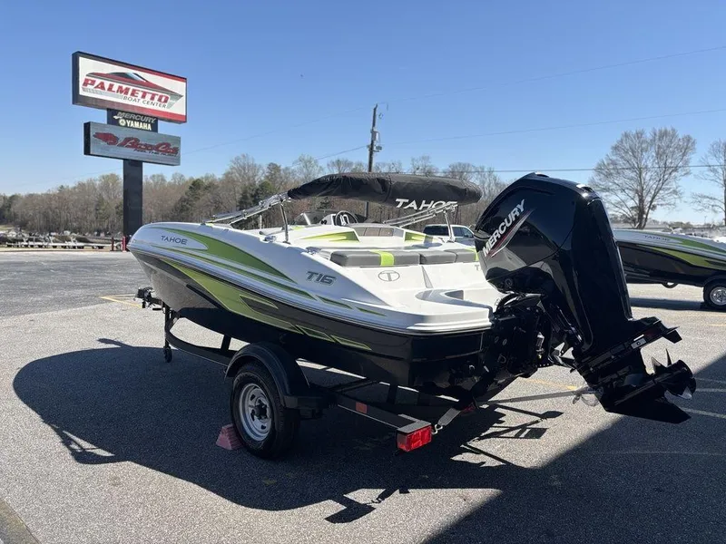 Slide: The Image of 2024 Tahoe T16 boat with Mercury engine on trailer, parked outdoors. - 5