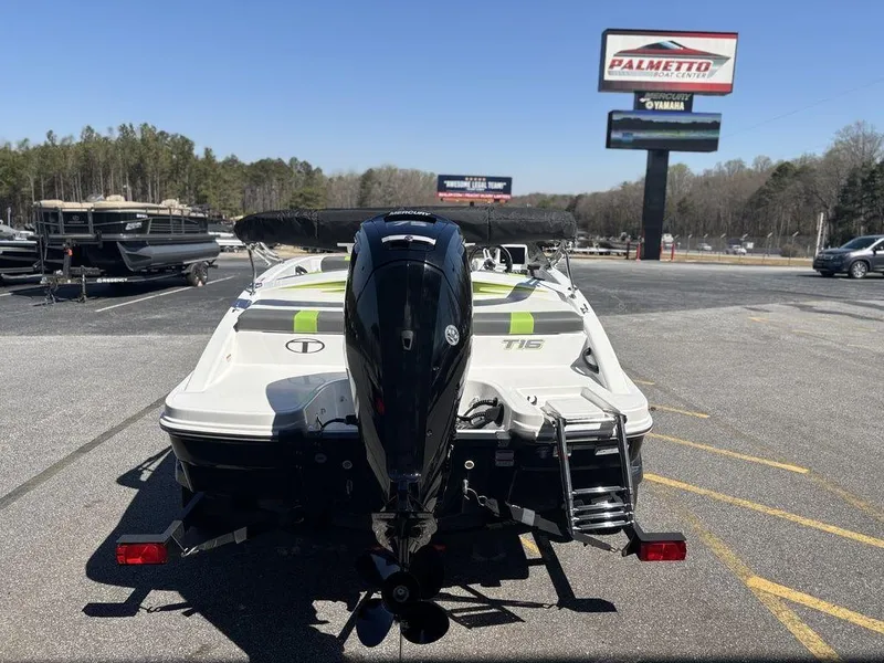 Slide: The Image of 2024 Tahoe T16 boat with outboard motor in dealership lot. - 7