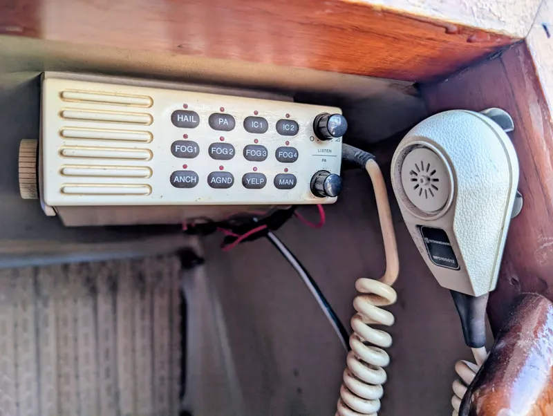 Slide: The Image of 1975 Downeast Ketch radio system with microphone and control panel. - 9