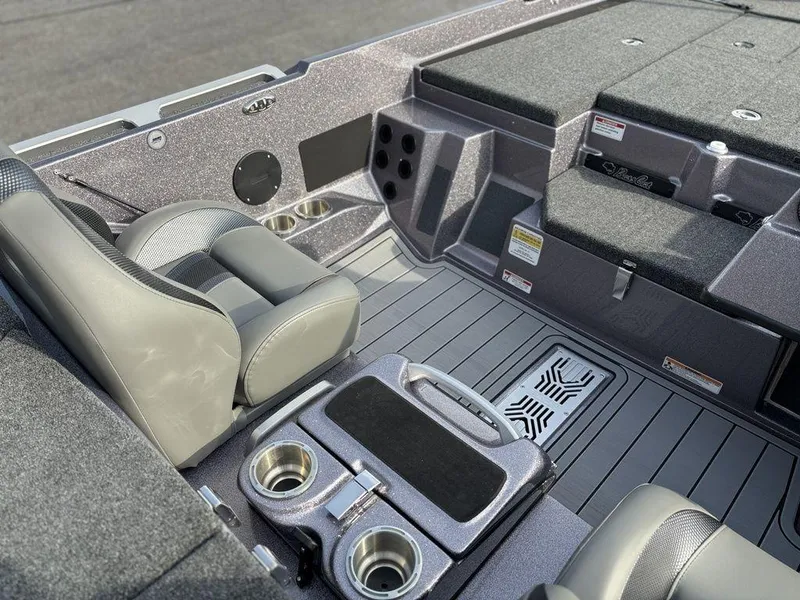 Slide: The Image of 2025 Bass Cat Puma STS boat interior with seating and storage compartments. - 13