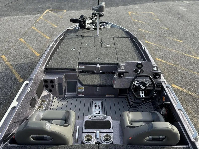 Slide: The Image of 2025 Bass Cat Puma STS boat interior with dual seats and advanced dashboard controls. - 14