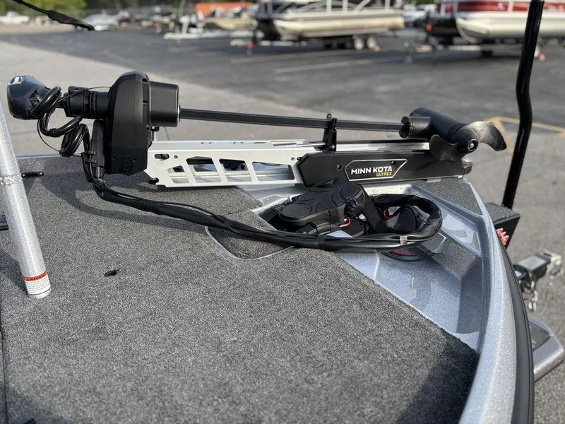 Slide: The Image of 2025 Bass Cat Puma STS boat with Minn Kota trolling motor on deck. - 16