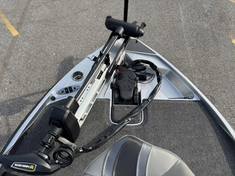 Slide: The Image of 2025 Bass Cat Puma STS boat deck with trolling motor and foot pedal controls. - 17