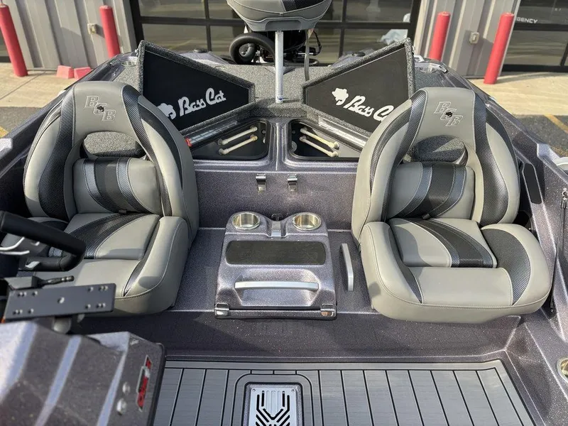 Slide: The Image of 2025 Bass Cat Puma STS boat interior with dual seats and cup holders. - 18