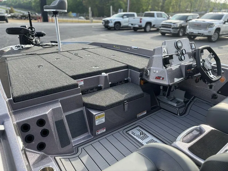 Slide: The Image of 2025 Bass Cat Puma STS boat interior with modern dashboard and seating. - 9