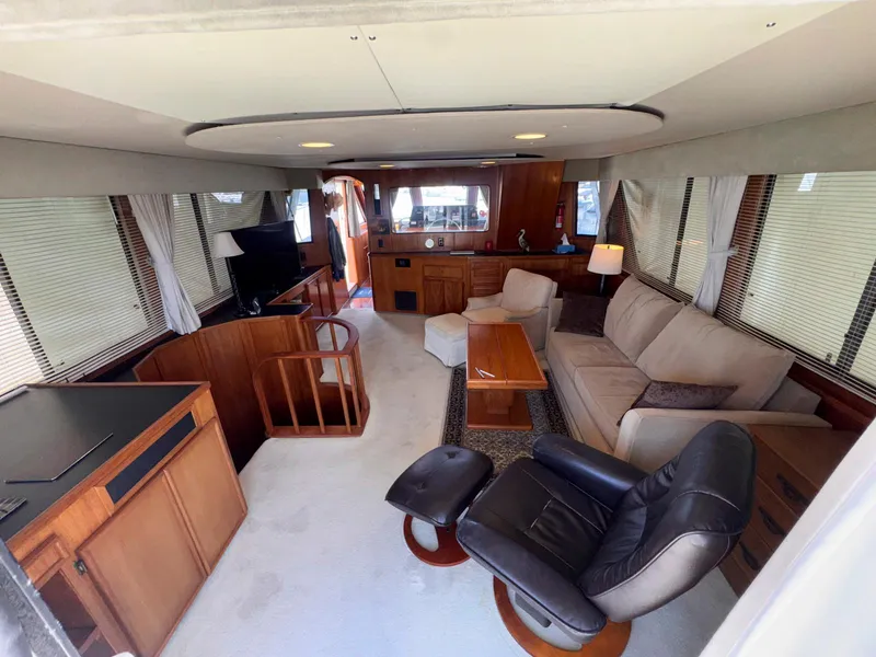 Slide: The Image of Luxurious interior of 1988 Chris-Craft 501 Motor Yacht with modern furnishings and ample seating. - 11
