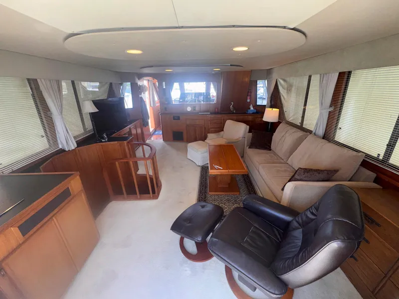 Slide: The Image of Luxurious interior of 1988 Chris-Craft 501 Motor Yacht with comfortable seating and elegant decor. - 13