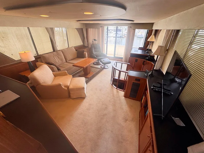 Slide: The Image of Luxurious interior of 1988 Chris-Craft 501 Motor Yacht with comfortable seating and elegant decor. - 14