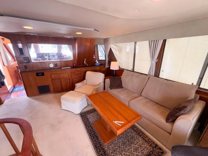 Slide: The Image of Luxurious interior of 1988 Chris-Craft 501 Motor Yacht with cozy seating and elegant decor. - 15