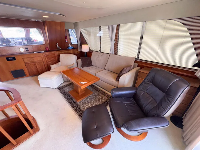 Slide: The Image of Luxurious interior of 1988 Chris-Craft 501 Motor Yacht with comfortable seating and elegant decor. - 18