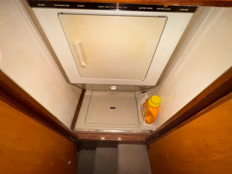 Slide: The Image of Laundry area inside 1988 Chris-Craft 501 Motor Yacht with detergent bottle. - 33