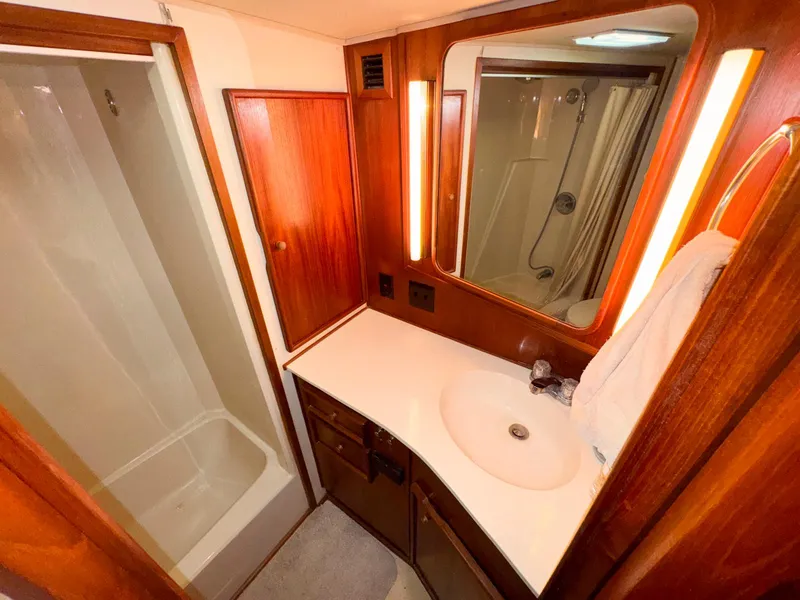 Slide: The Image of Bathroom interior of 1988 Chris-Craft 501 Motor Yacht with wood accents and shower. - 42