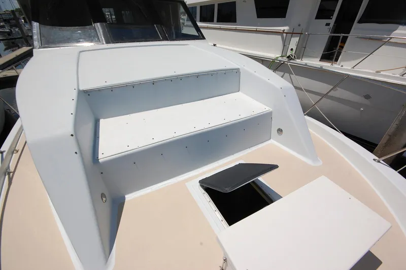 Slide: The Image of 1988 Chris-Craft 501 Motor Yacht deck with steps and open hatch. - 7