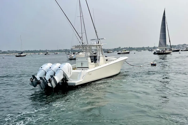 Slide: The Image of 2016 SeaVee 340Z boat with triple engines on a calm sea. - 4