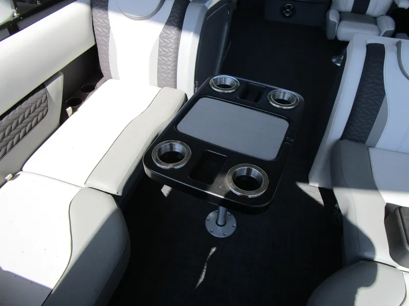 Slide: The Image of Interior of 2025 MONACO Cruise 235 C boat with seating and cup holders. - 10