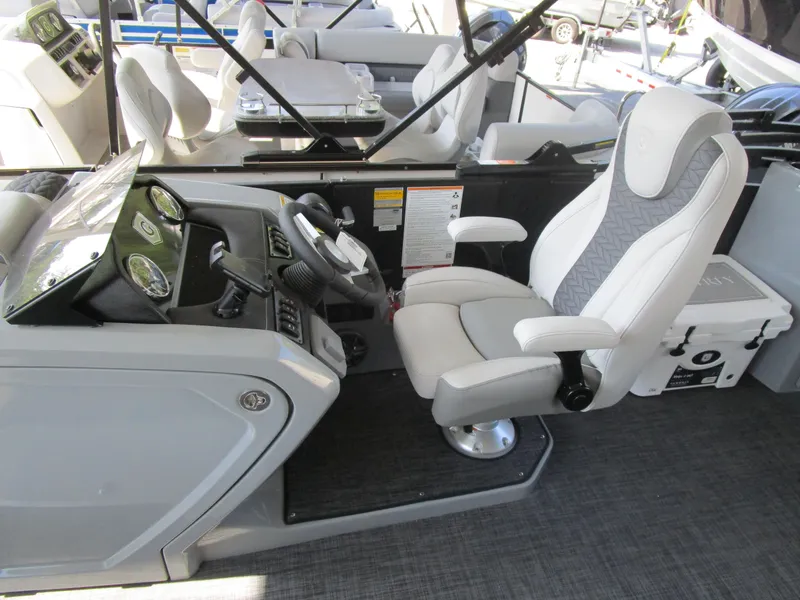 Slide: The Image of Captain's seat and dashboard of 2025 MONACO Cruise 235 C boat. - 3