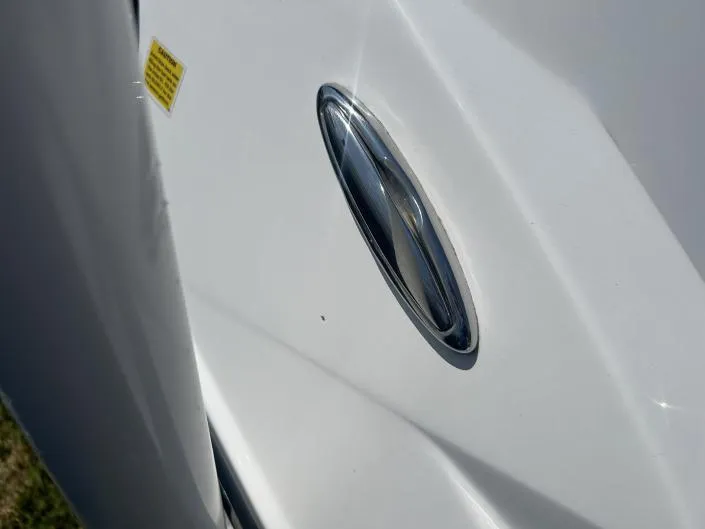Slide: The Image of Close-up of 2021 Hurricane SunDeck Sport 185 OB boat detail, featuring sleek design elements. - 11