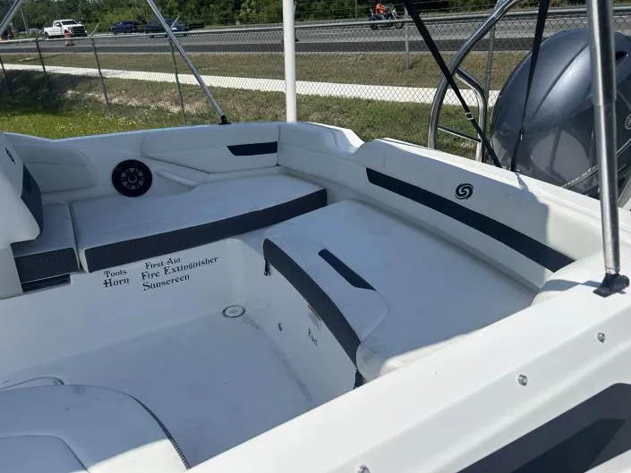 Slide: The Image of 2021 Hurricane SunDeck Sport 185 OB boat interior with seating and safety equipment labels. - 5