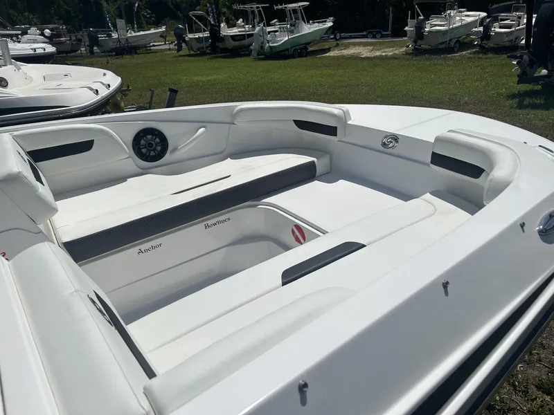 Slide: The Image of 2021 Hurricane SunDeck Sport 185 OB boat interior with white seating and speaker. - 8