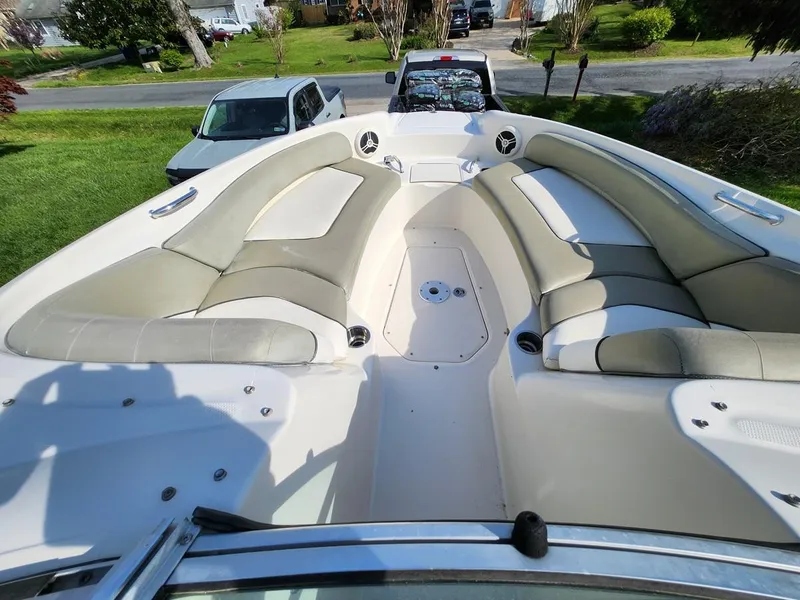 Slide: The Image of 2006 Sea Ray 240 Sundeck boat with spacious seating and sleek design. - 13