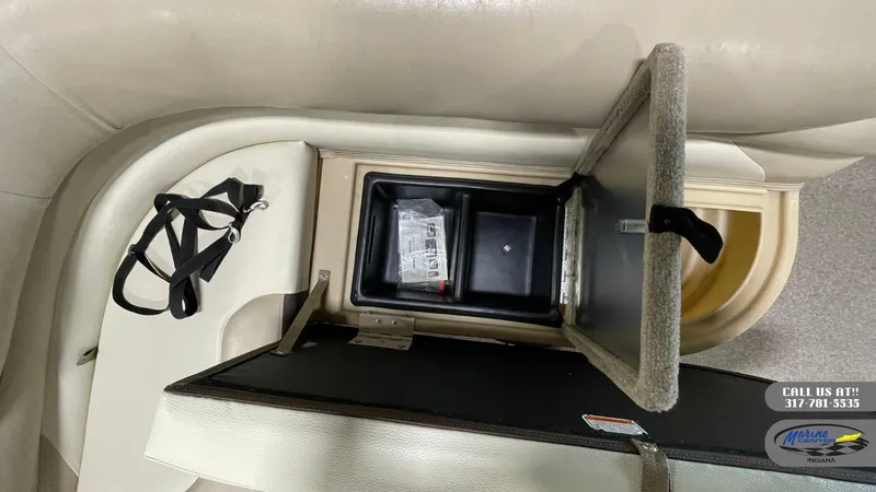 Slide: The Image of Open storage compartment on 2016 Sun Tracker Party Barge 22 DLX pontoon boat. - 11