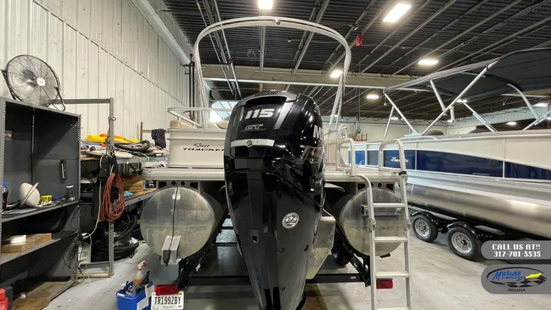 Slide: The Image of 2016 Sun Tracker Party Barge 22 DLX with Mercury 115 engine in a storage facility. - 7