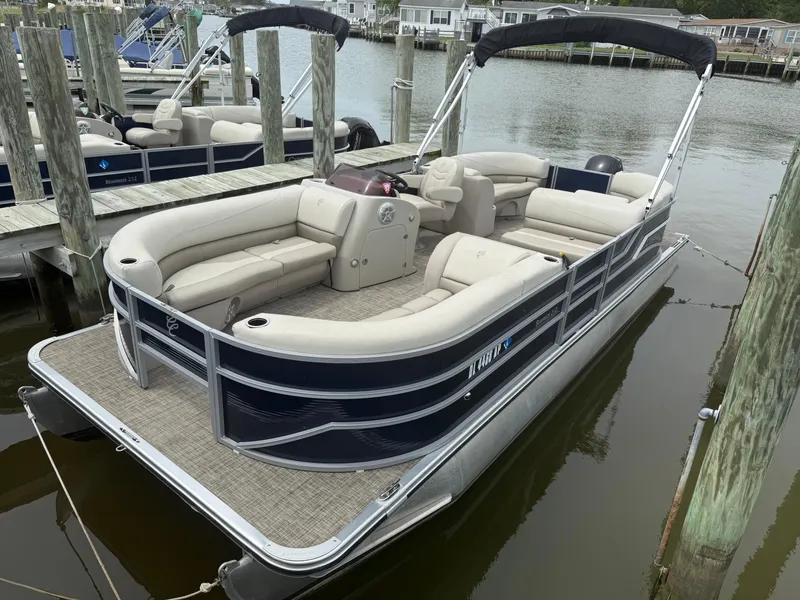 Slide: The Image of 2023 Cypress Cay Seabreeze 232 pontoon boat docked at marina. - 9