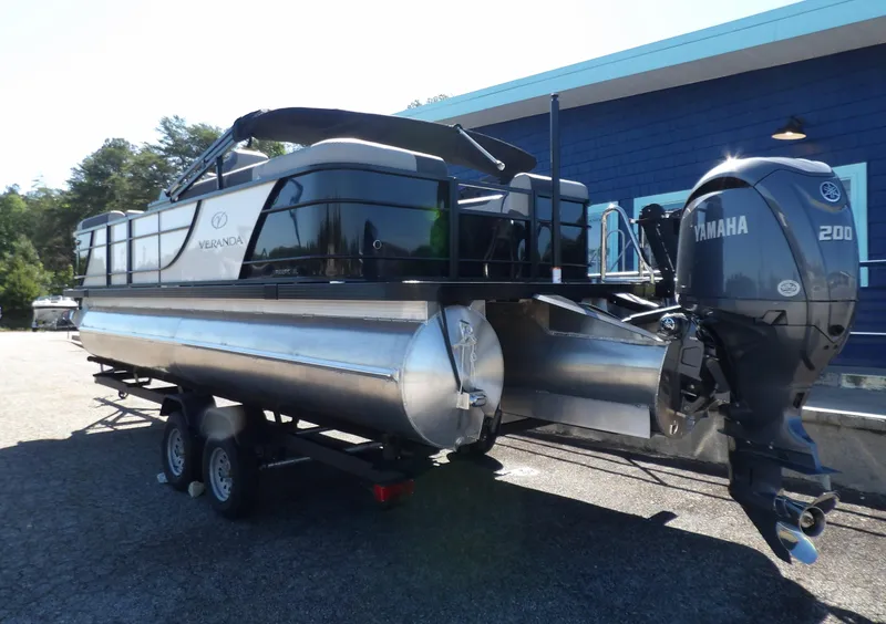 Slide: The Image of 2025 Veranda Relax 22 RC pontoon boat with Yamaha 200 engine on trailer. - 3
