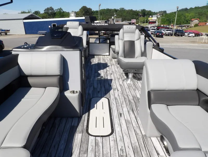 Slide: The Image of 2025 Veranda Relax 22 RC pontoon boat with stylish seating and modern design. - 5