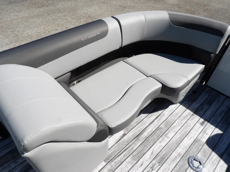 Slide: The Image of Luxurious seating on 2025 Veranda Relax 22 RC pontoon boat, featuring sleek gray upholstery. - 6