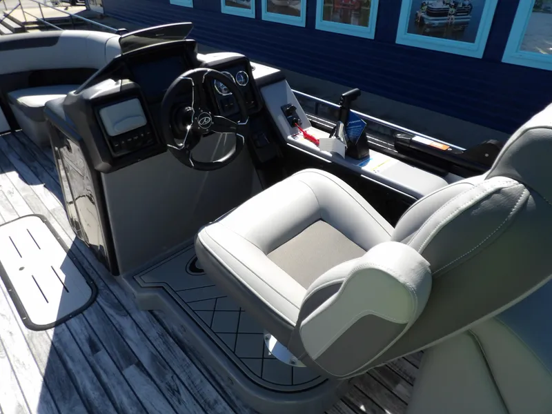 Slide: The Image of 2025 Veranda Relax 22 RC boat interior with modern helm and comfortable seating. - 7