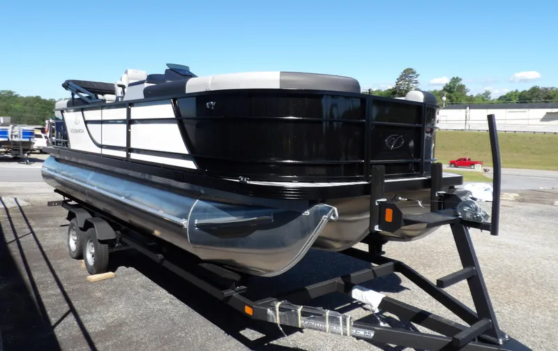 Slide: The Image of 2025 Veranda Relax 22 RC pontoon boat on trailer, black and white design. - 8