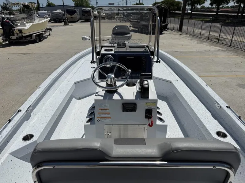 Slide: The Image of 2023 Xpress H22 Bay boat interior with steering console and seating. - 10