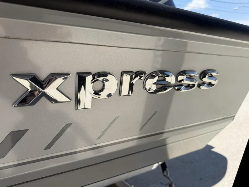 Slide: The Image of 2023 Xpress H22 Bay boat logo in shiny chrome lettering. - 3