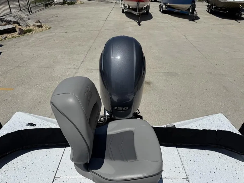 Slide: The Image of 2023 Xpress H22 Bay boat with 150 HP engine and gray seating. - 6