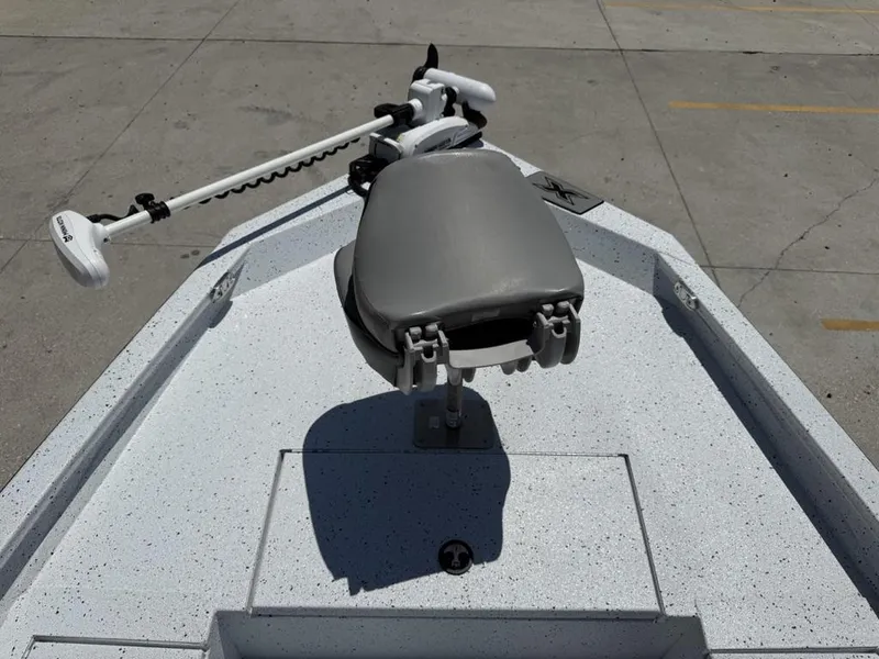Slide: The Image of 2023 Xpress H22 Bay boat with a trolling motor and seat on deck. - 9