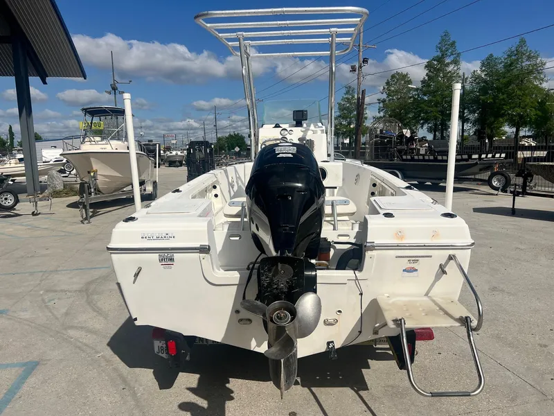 Slide: The Image of 2007 Sea Fox Pro Series Center Console 197 boat with outboard motor, parked outdoors. - 4