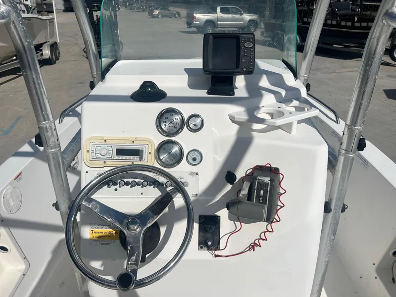 Slide: The Image of 2007 Sea Fox Pro Series Center Console 197 dashboard with steering wheel and gauges. - 7