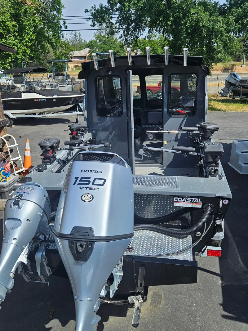 Slide: The Image of 2023 RH Boats 22 Coastal Hardtop with Honda 150 VTEC engine, parked outdoors. - 3