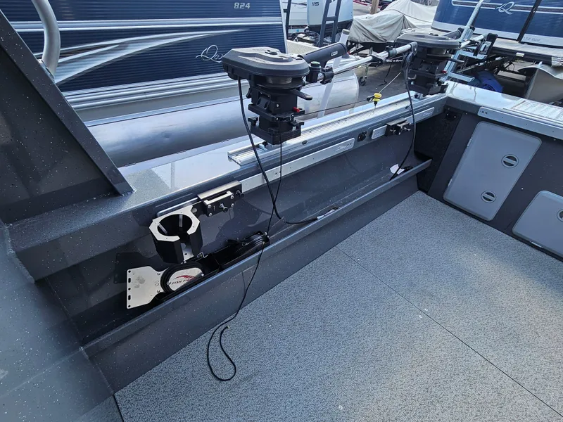 Slide: The Image of 2023 RH Boats 22 Coastal Hardtop interior with fishing equipment and storage compartments. - 30