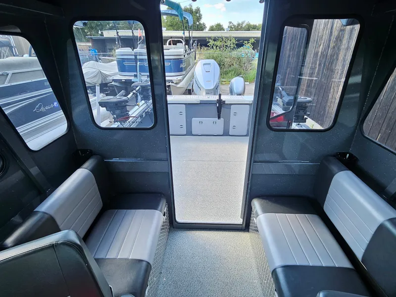 Slide: The Image of 2023 RH Boats 22 Coastal Hardtop interior with seating and rear deck view. - 31