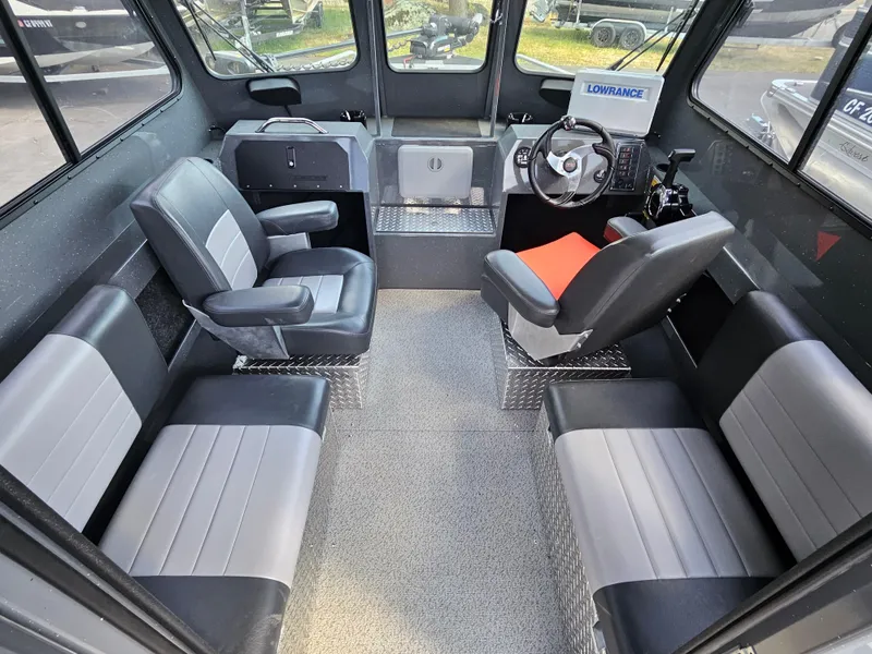 Slide: The Image of 2023 RH Boats 22 Coastal Hardtop interior with seating and steering console. - 32