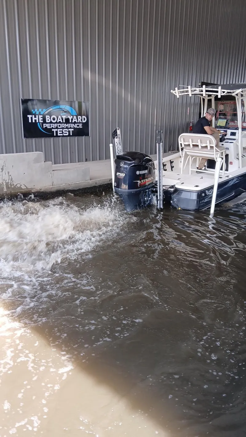Slide: The Image of BlackJack 224 boat undergoing performance test in water at The Boat Yard, 2013 model. - 11