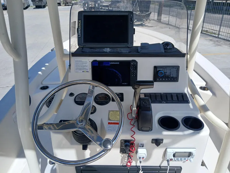 Slide: The Image of 2013 BlackJack 224 boat console with steering wheel, Lowrance electronics, and control panel. - 7