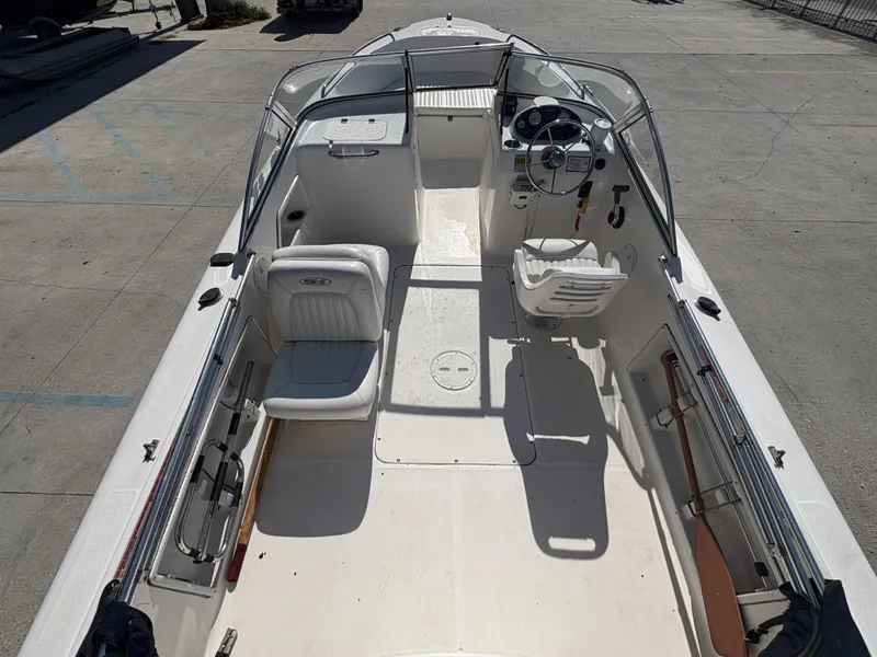 Slide: The Image of 2007 Sea Hunt Escape 200 boat interior with seating and steering console. - 12