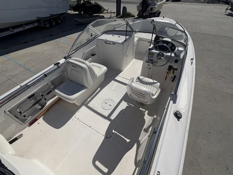 Slide: The Image of 2007 Sea Hunt Escape 200 boat interior with steering console and seating. - 13
