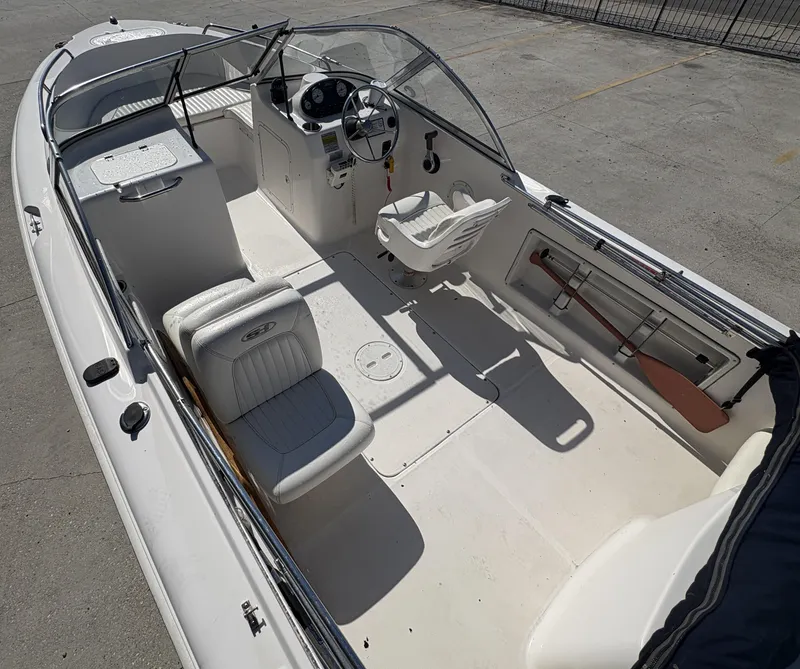 Slide: The Image of 2007 Sea Hunt Escape 200 boat interior with steering wheel and seating. - 14