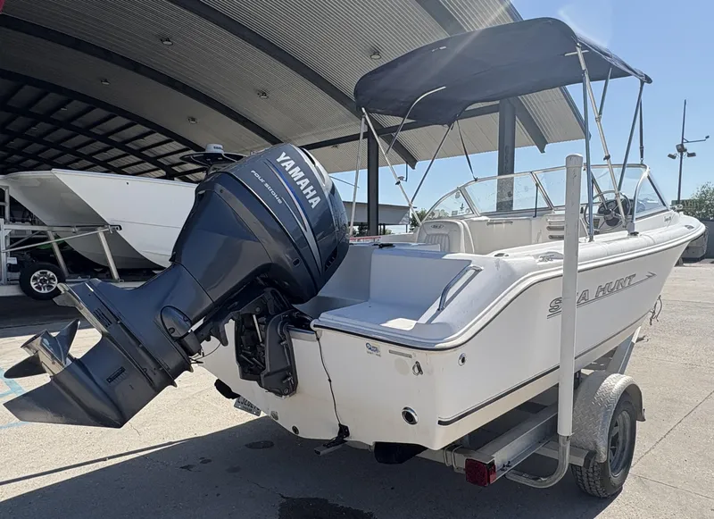 Slide: The Image of 2007 Sea Hunt Escape 200 boat with Yamaha outboard motor on trailer. - 3