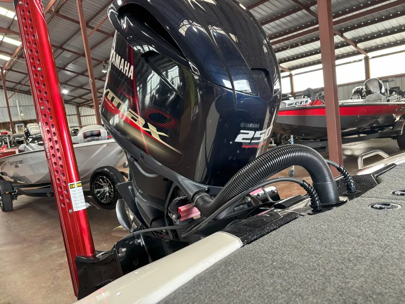 Slide: The Image of 2021 Skeeter ZXR21 boat with Yamaha 250 engine in a storage facility. - 10